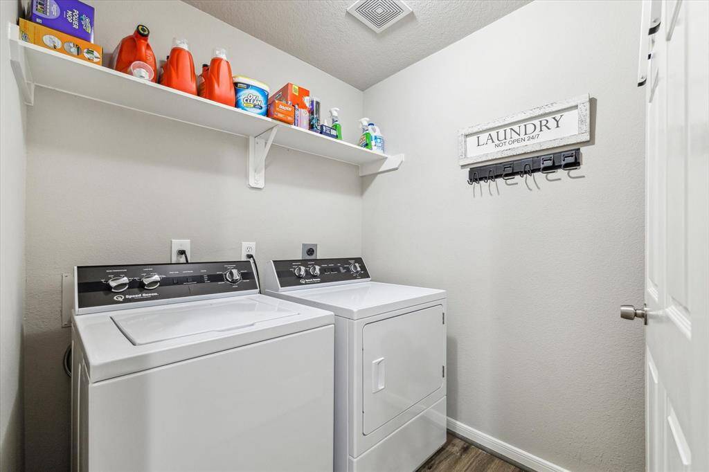 Laundry room with storage shelf