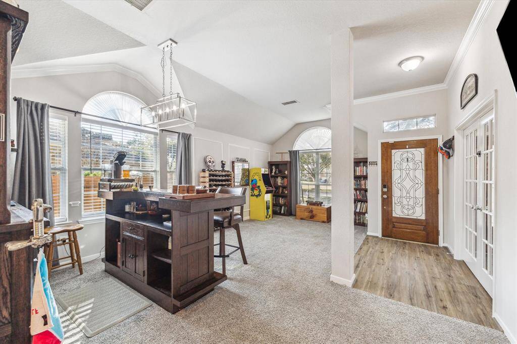Step into a versatile living and dining area that welcomes you with abundant natural light and open space.