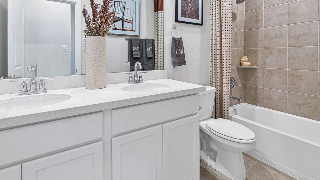 Structural options added include: Covered patio, 8' entry doors and pop-up ceiling in family room and primary bathroom.