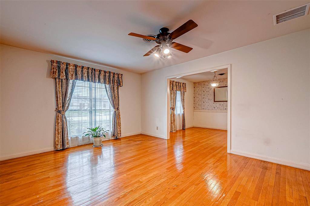 This formal living room offers a bright and versatile canvas, ready to be transformed into the space of your dreams. Add plush seating and a statement coffee table for a welcoming lounge.