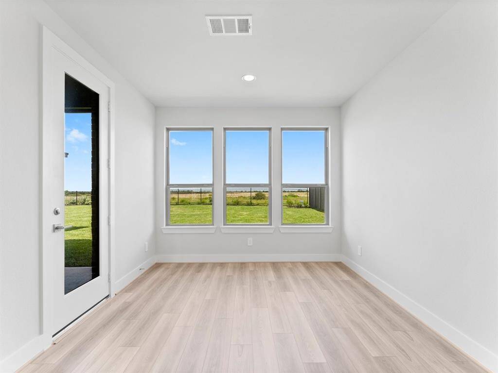Breakfast Room with Access to the Covered Rear Patio and Fenced Back Yard