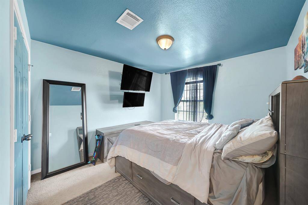 One of the spacious secondary bedrooms upstairs