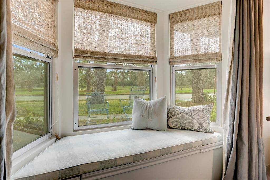 A bay window seating area compliments the nature views from the primary and offers bench storage.