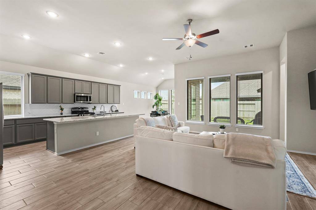 Wood-look tile all throughout the main areas of the home + LOTS of windows that bring in plenty of natural sunlight!