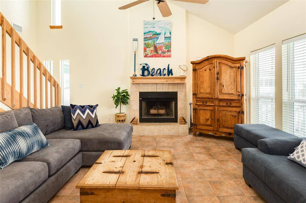 Living room features a wood-burning fireplace