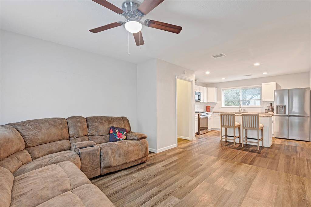 An open-concept view of the kitchen and living area.