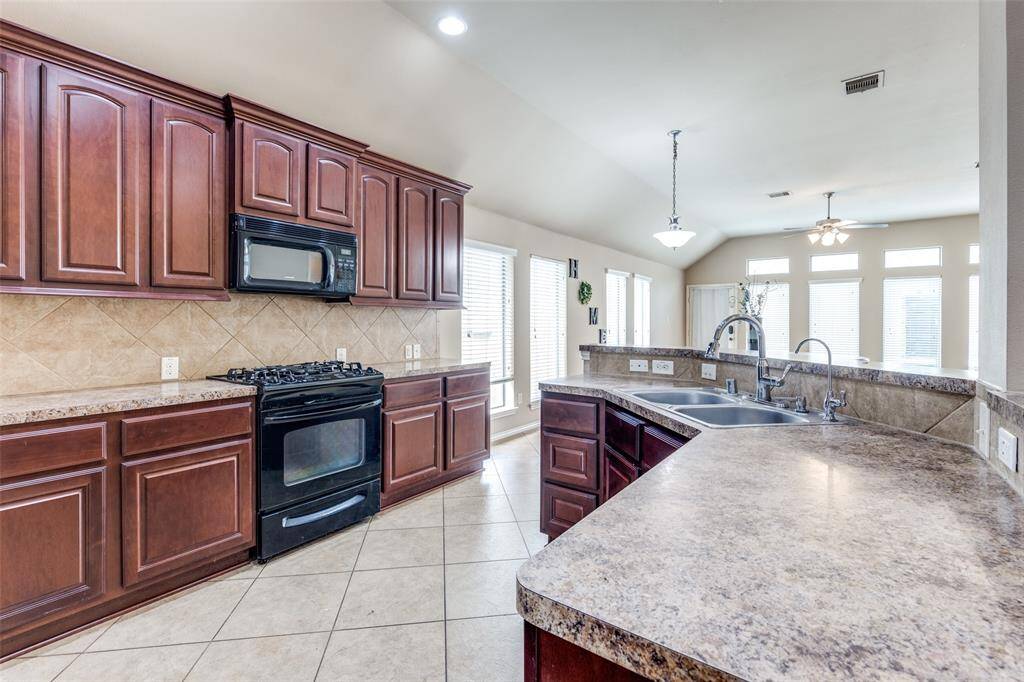The Kitchen is adjacent to the Breakfast area
