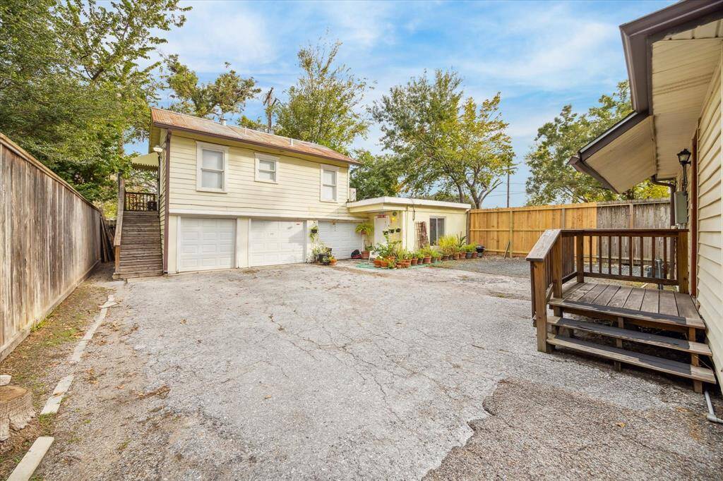 3 car garage and 2 apartment units with additional parking spaces.