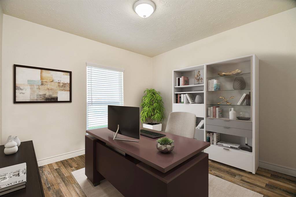 Virtually Staged: This charming home office space is the perfect place to read your favorite book or get some work done! It features laminate floors, and a window with privacy blinds.