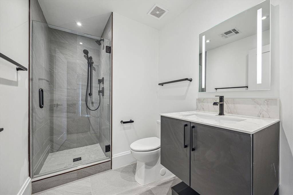 Secondary bath with walk-in shower, Eggersmann cabinet.