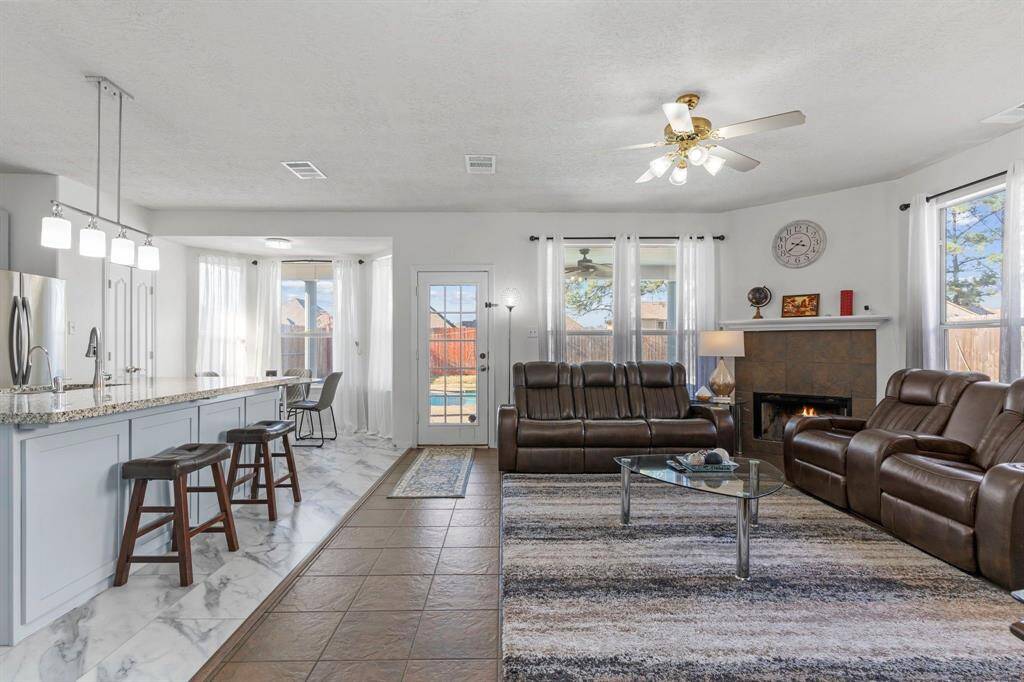 The main family area features beautiful large tile floors and a stunning view of your pool!
