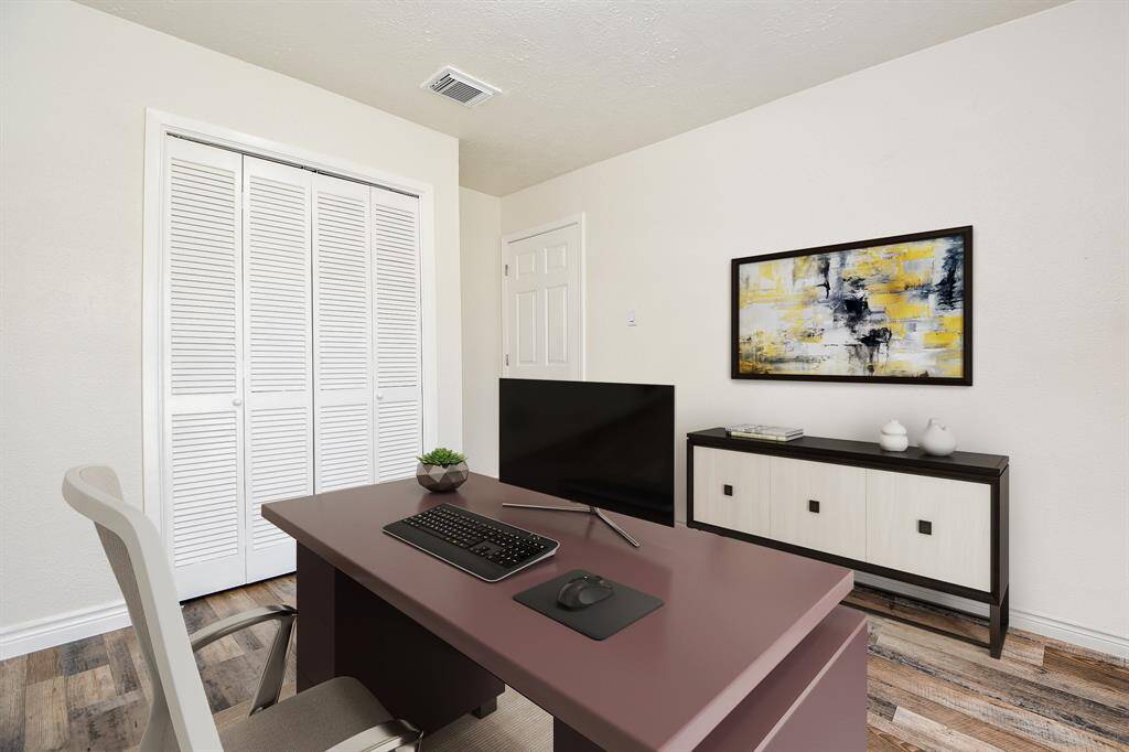 Virtually Staged: This room is so flexible that it could easily become an additional secondary bedroom, it includes a built-in closet.