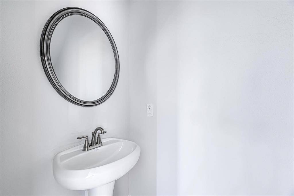 Having a half bathroom downstairs is HUGE!! Conveniently located close to the kitchen & foyer/entry.