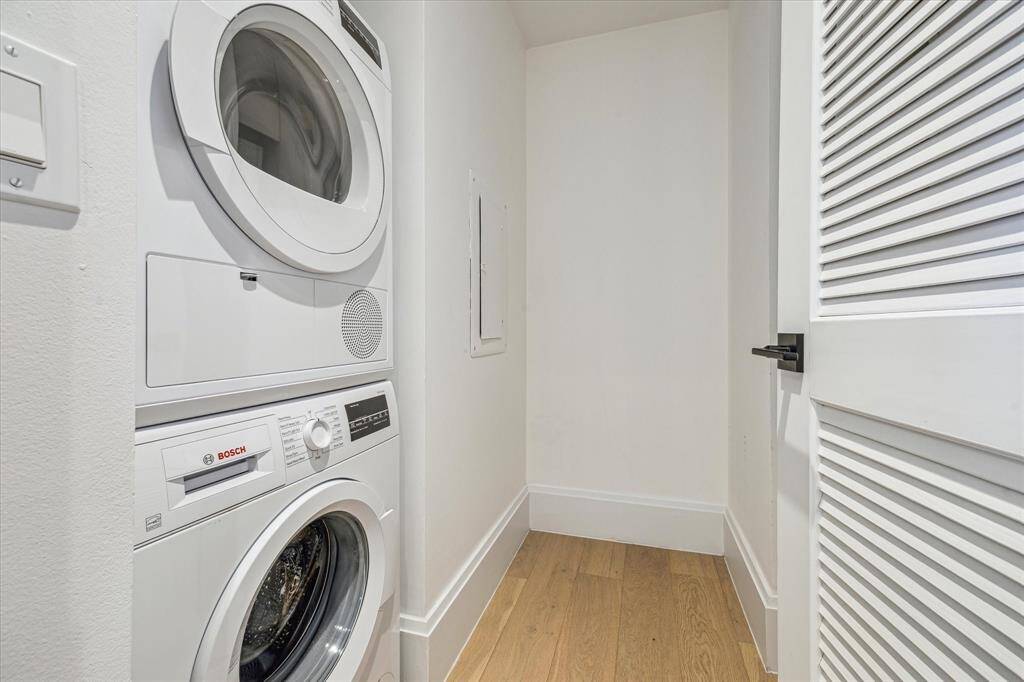 Stacked washer / dryer are included.