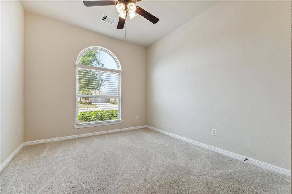 At the front of the home is the 2nd bedroom with its curved window that overlooks the cul de sac.
