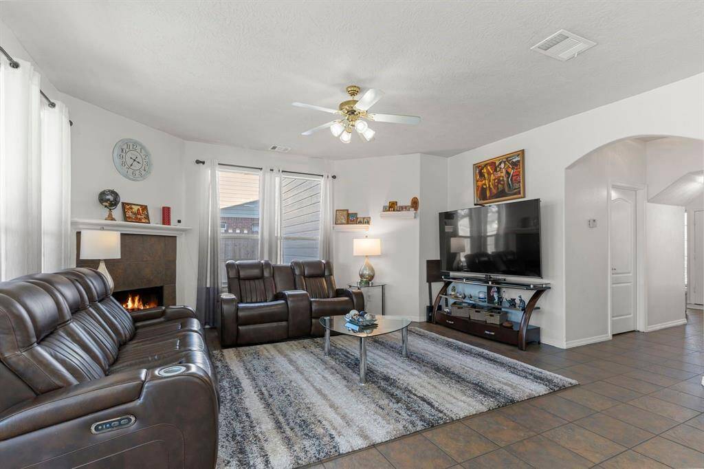 The family area boasts a cozy fireplace, perfect for chilly evenings and holiday gatherings!