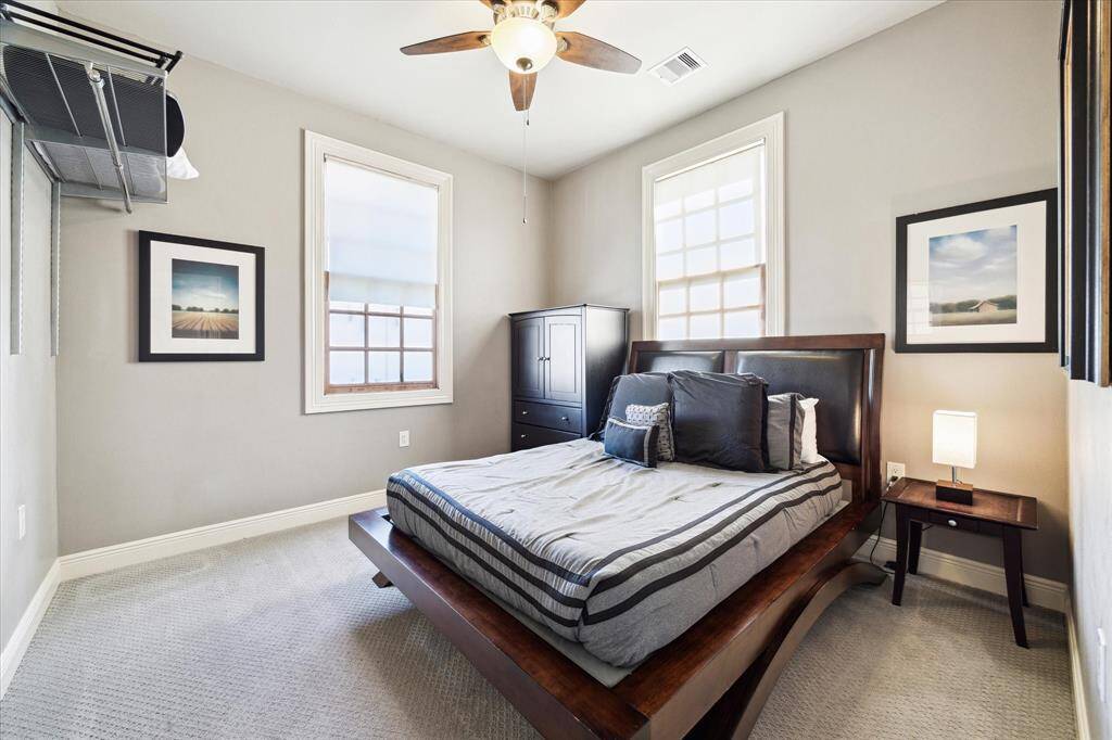 Two corner bedrooms feature double exposures, cozy carpeting and ceiling fans.