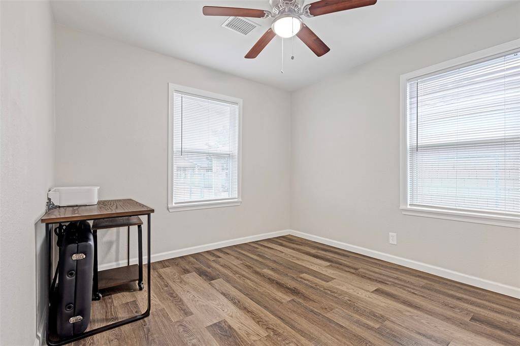 A versatile blank room featuring windows on two sides, filling the space with natural light and offering endless possibilities for customization