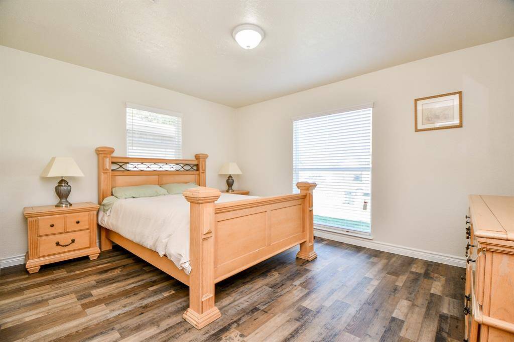 Unwind after a long day in this incredibly spacious Primary Bedroom! Featuring lots of natural light, laminate wood floors, and privacy blinds.