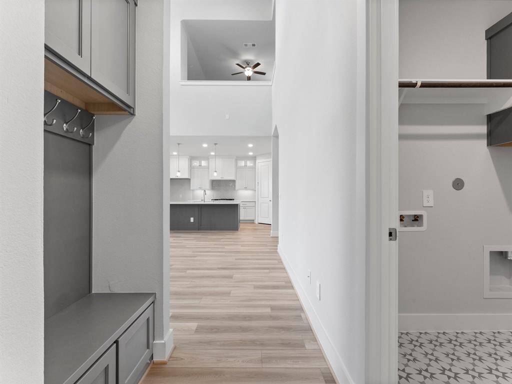 Built-in Bench with Hooks and Storage Cabinets At Garage Entry