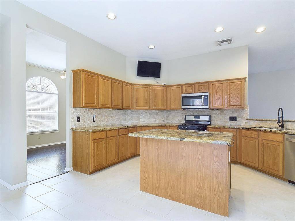 Look at the island with workspace countertop.