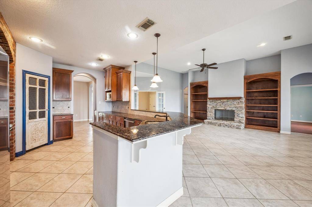 View into the Kitchen & Living room from the Breakfast area