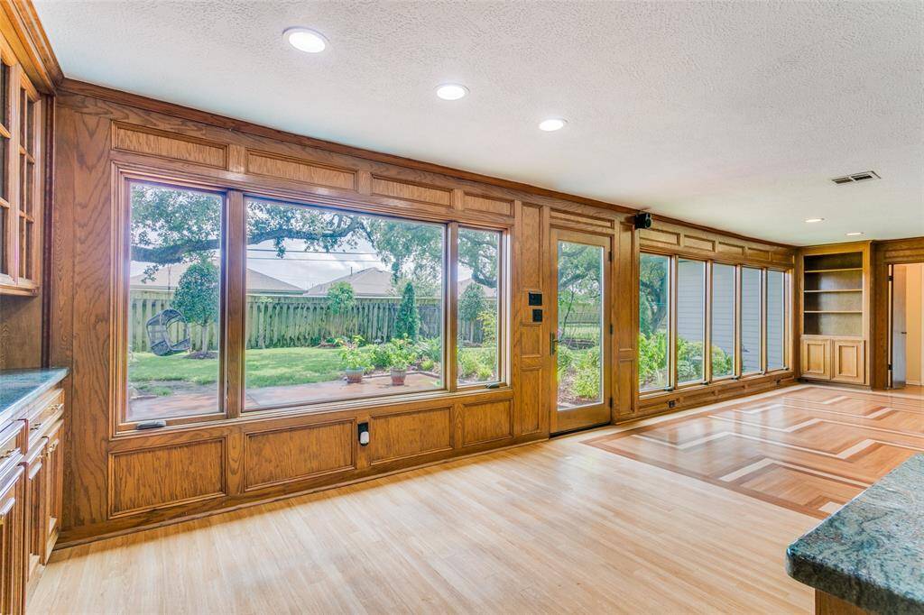The breakfast area is open to the family room and has a great view of the beautiful backyard.