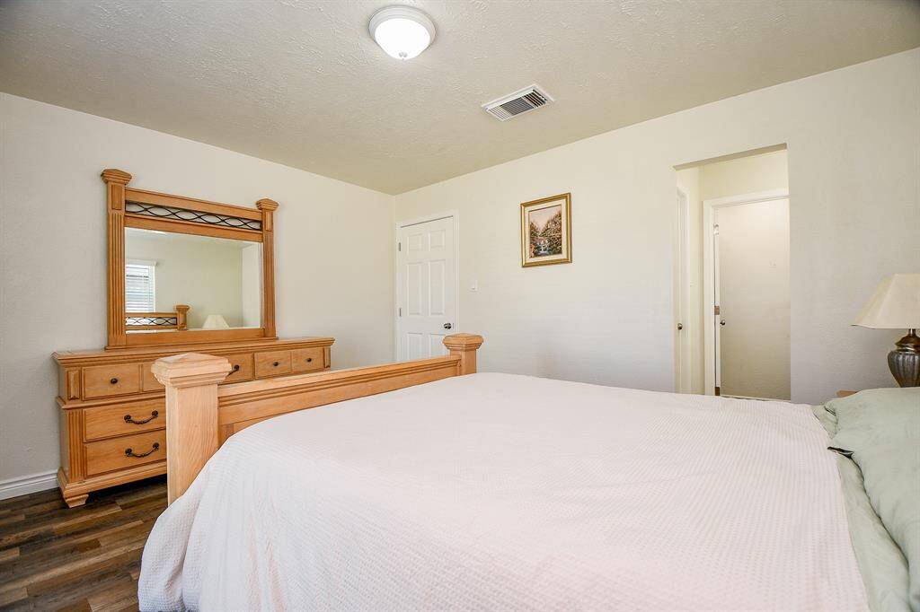 This primary bedroom is complete with an en-suite bathroom.