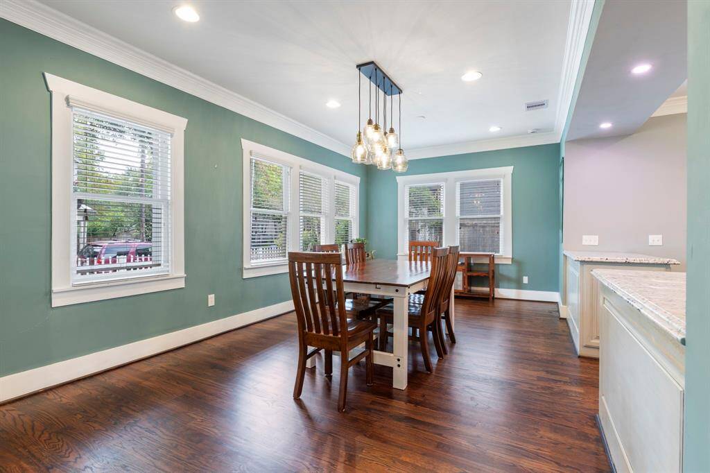 Beautiful wood floors, high ceilings, recessed lighting.  Peaceful views from this room to your front porch and yard.