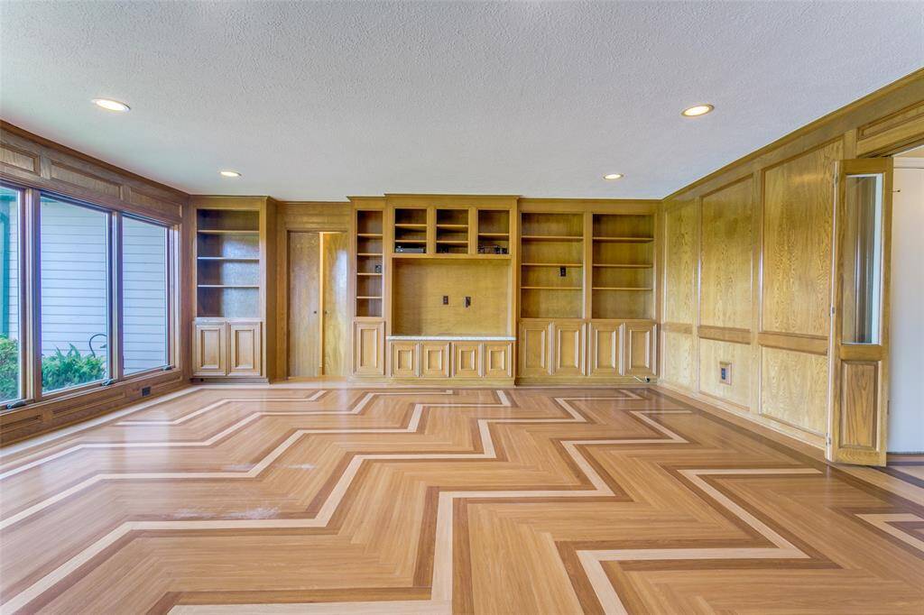 The doors lead into the downstairs primary bedroom suite.