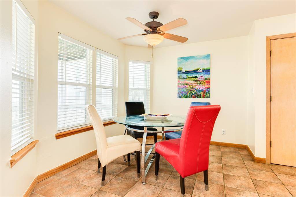 Dining area features a bay window that overlooks the main level screened-in porch