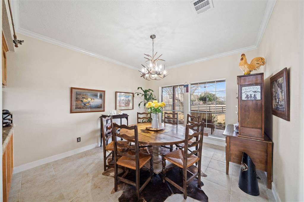 Lots of natural light comes in through the large windows in the dining area, making the room feel open and spacious!