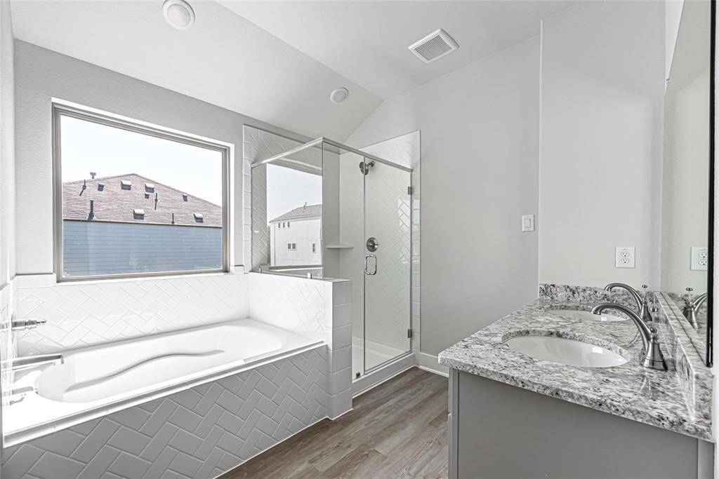 This home is just full of little surprises & upgrades! Just look at this lovely and unique primary bathroom area! Add in some decor and make it your own!