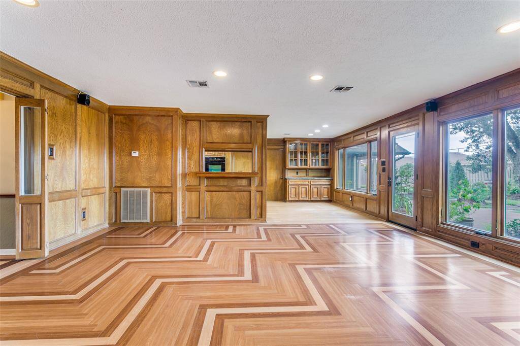The breakfast room has additional custom built cabinets with matching granite countertop - great during get togethers.