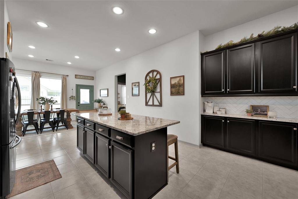 The bank of cabinets to the right and extra counter space adds to the exceptionality of this home!