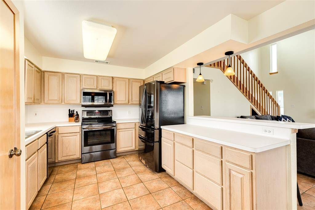 Kitchen has loads of counter space and a separate pantry
