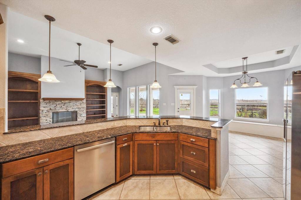View into the Living room with lots of extra counter space to add bar stools for entertaining