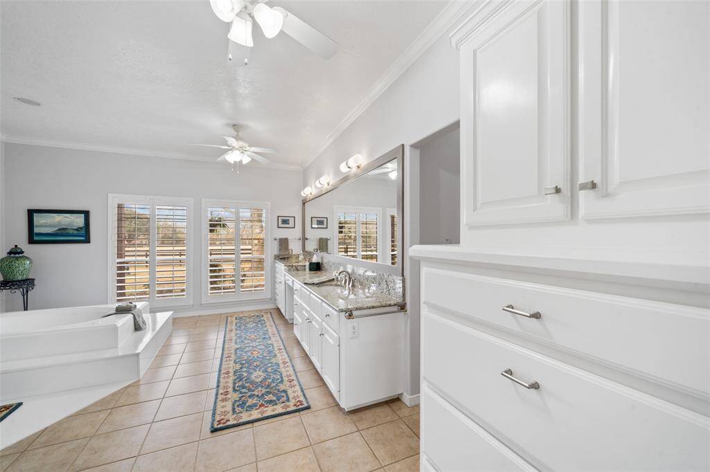 The primary bathroom has so much to offer with large windows, a HUGE soaking tub and double vanity.