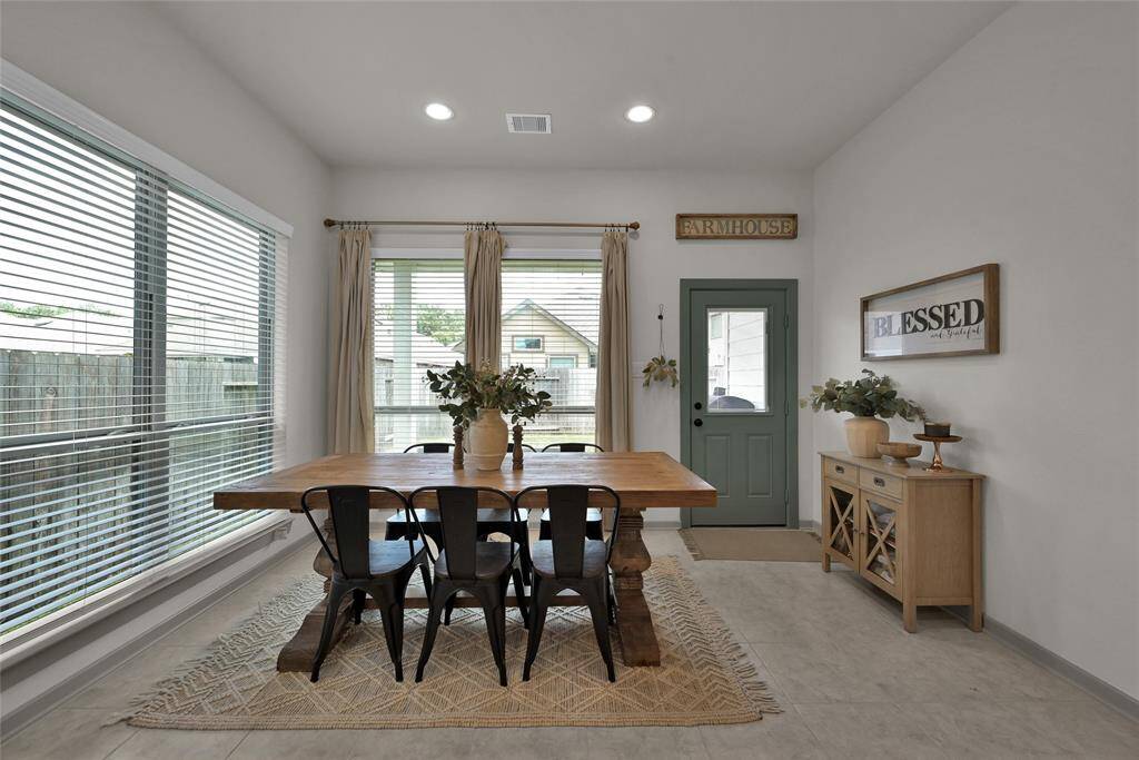 Open concept dining area with largewindows that provide the perfect amount of natural light.