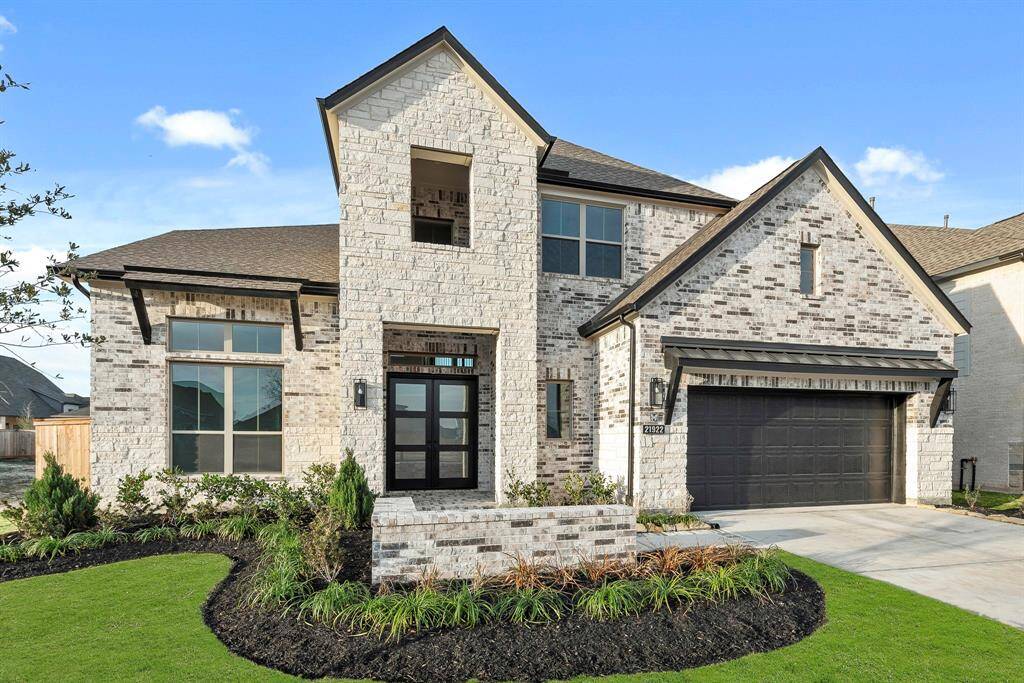 MOVE IN READY!! Westin Homes NEW Construction (Asher IX, Elevation A) Two story. 5 bedrooms. 4.5 baths. Green grass added to enhance photo.