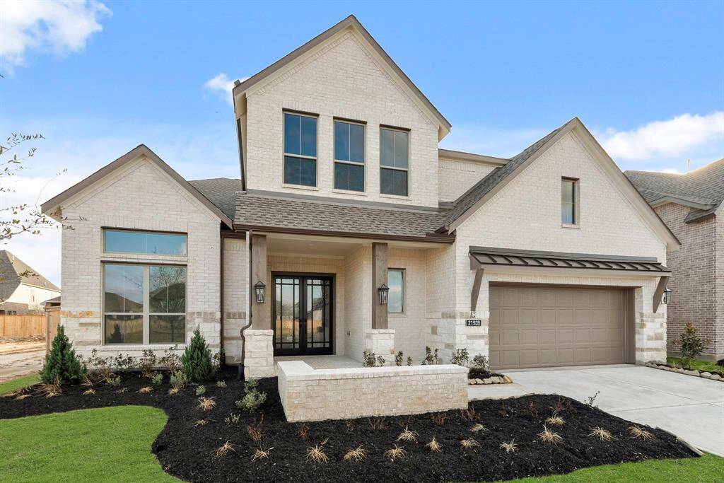 MOVE IN READY!! Westin Homes NEW Construction (Asher IX, Elevation B) Two story. 5 bedrooms. 4.5 baths. Green grass added to enhance photo.