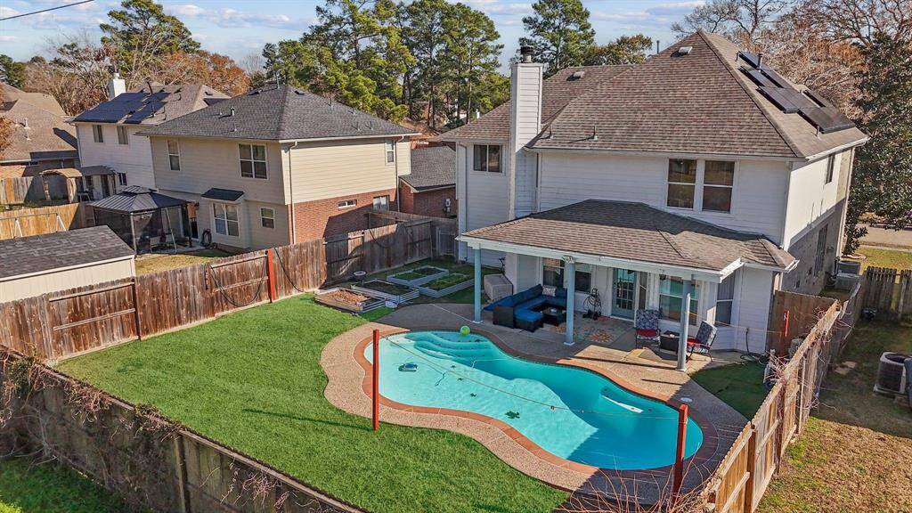 Escape to your private tropical oasis with a sparkling pool and no backyard neighbors! This home features a double-wide driveway, porte-cochere, spacious covered patio, and a sprinkler system. Energy perks include insulated windows, solar panels, a Tesla Powerwall, and a Tesla charging station!