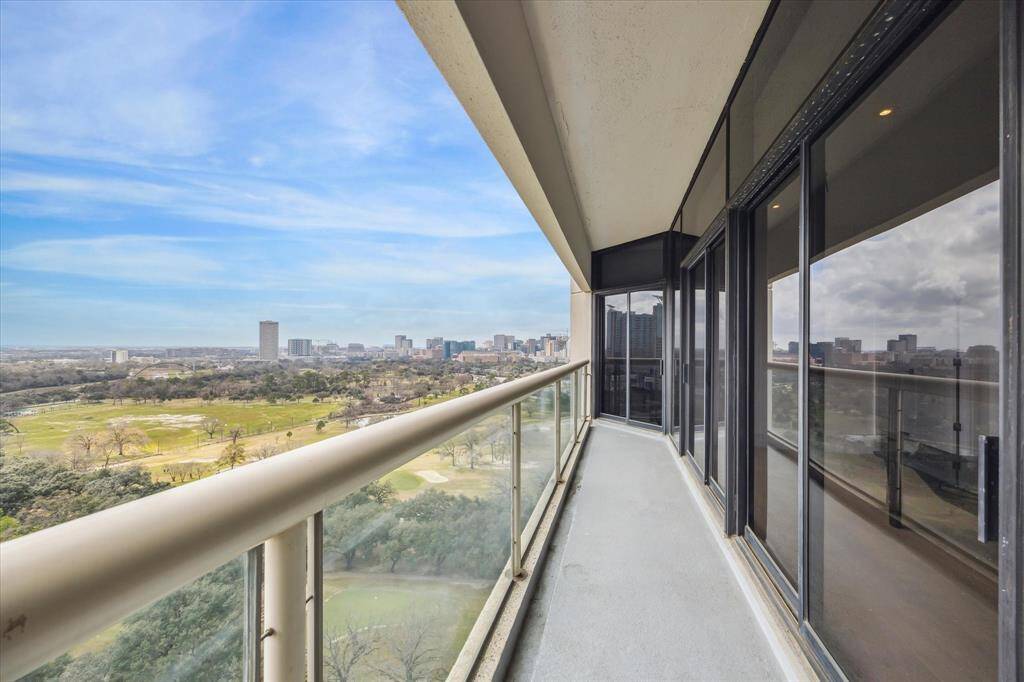 Beautifully updated condo overlooking Hermann Park with sweeping southern views to east and west!