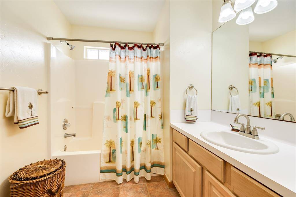 Full bathroom on the main level has a new countertop and features a tub with shower