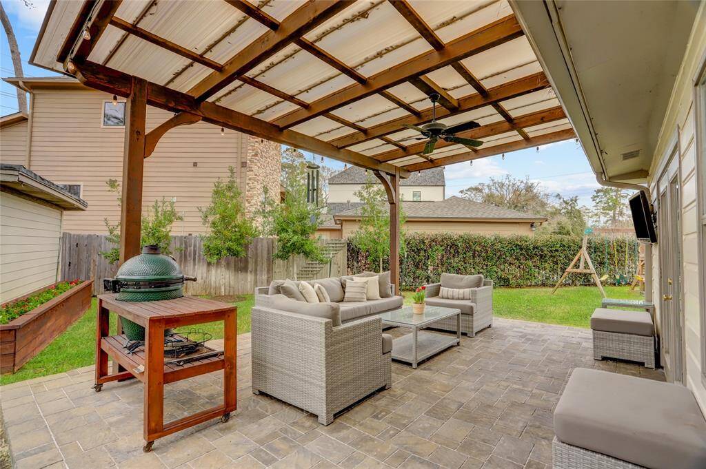 Built in 2019, the stamped concrete covered patio is a wonderful touch for protected outdoor activities.