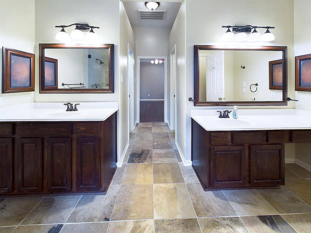 Double sinks and vanities in primary bathroom