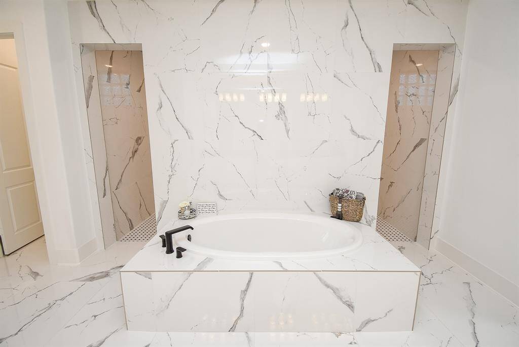 The huge walk-in shower sits just behind the tub.