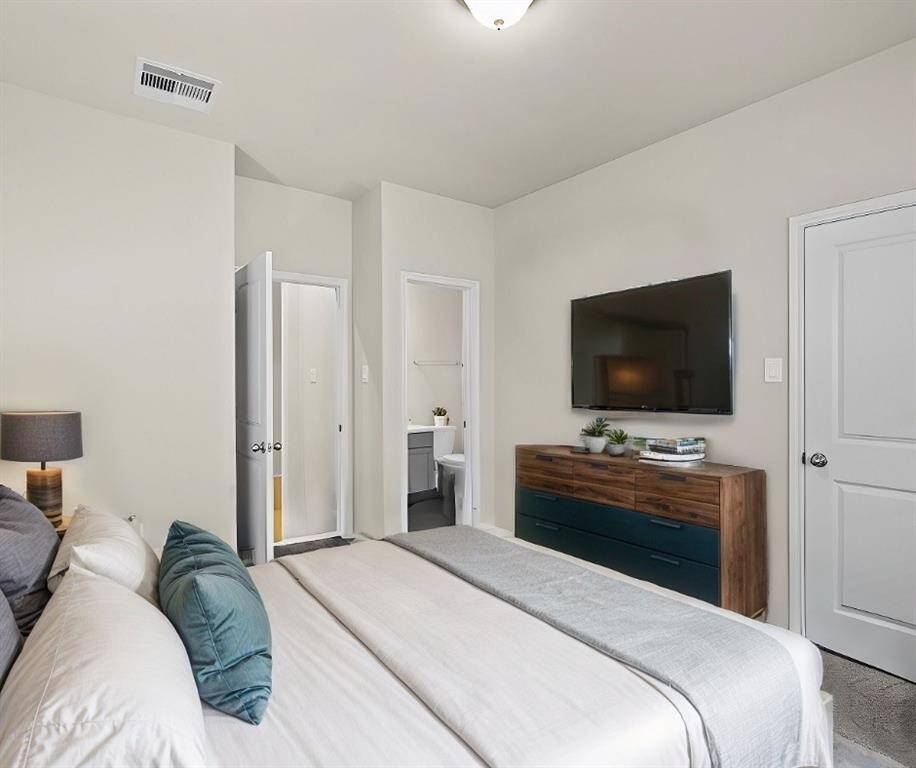 Virtually Staged: The guest suite is located on the opposite side of the hall for added privacy