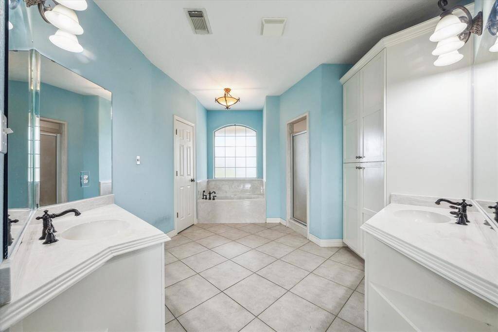 Primary bath with double sink space and double closets
