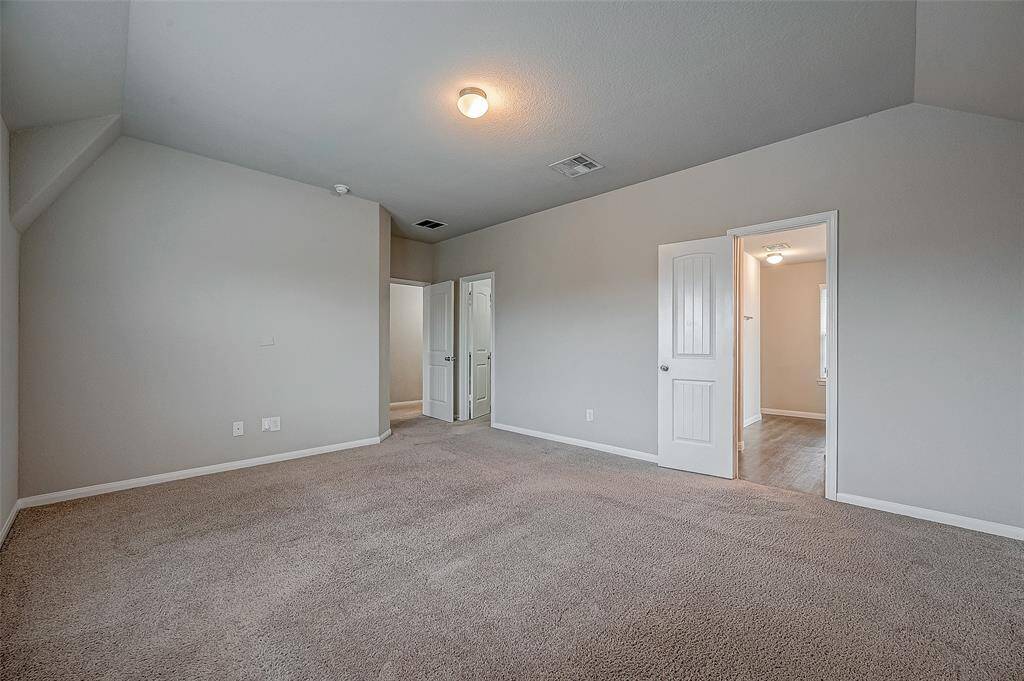 Another view of primary looking toward ensuite bath